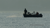 Fisherman at his boat