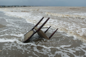 A chair washed ashore at Oropos lagoon