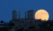 Moonrise of the fullmoon behind the temple of Poseidon at cape Sounio